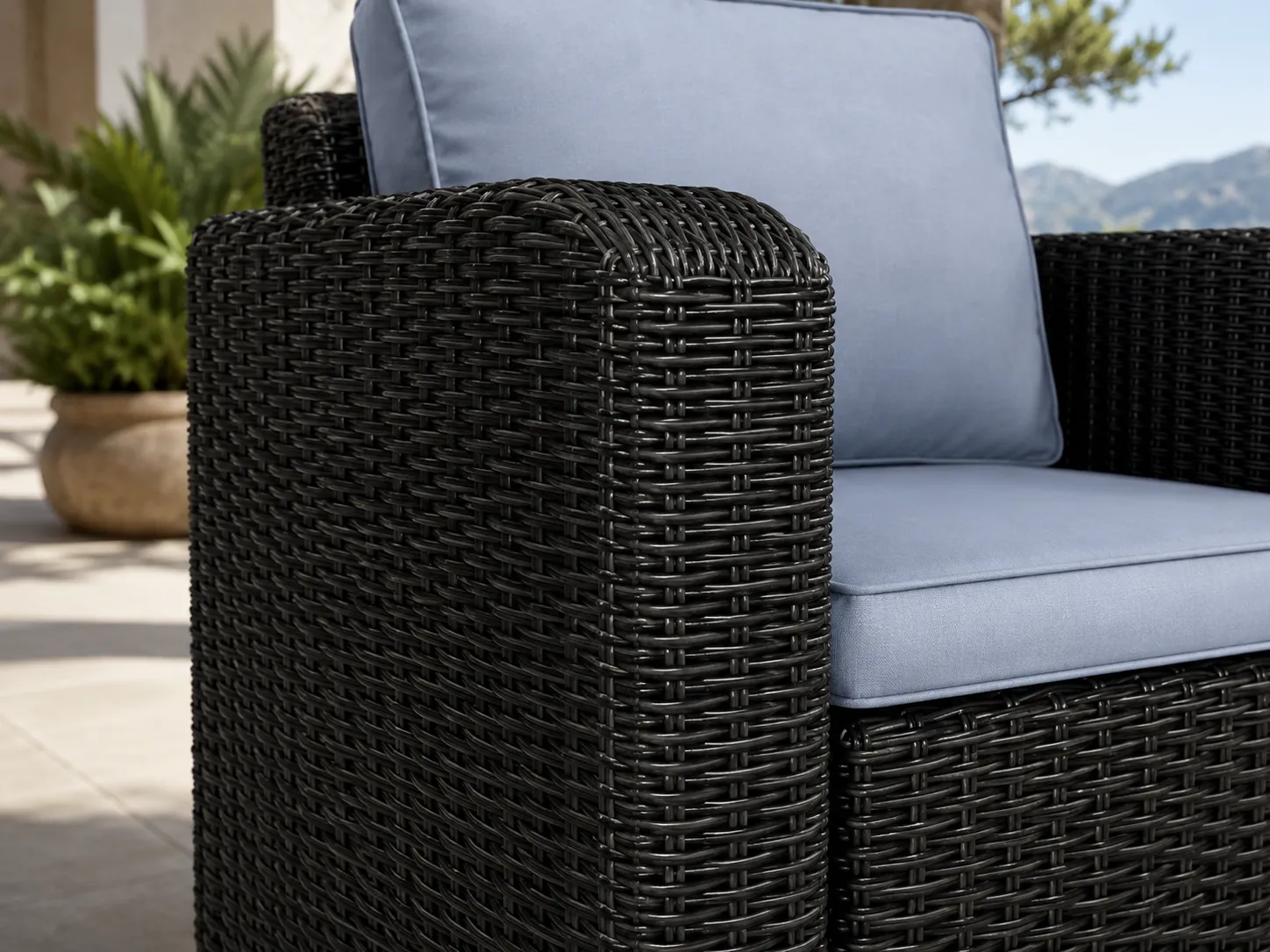 Black PE rattan wicker detail of outdoor armchair