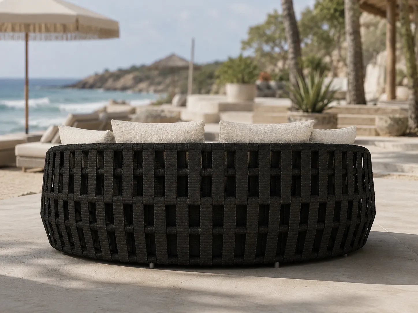 Back view of black wicker outdoor daybed with woven rattan frame