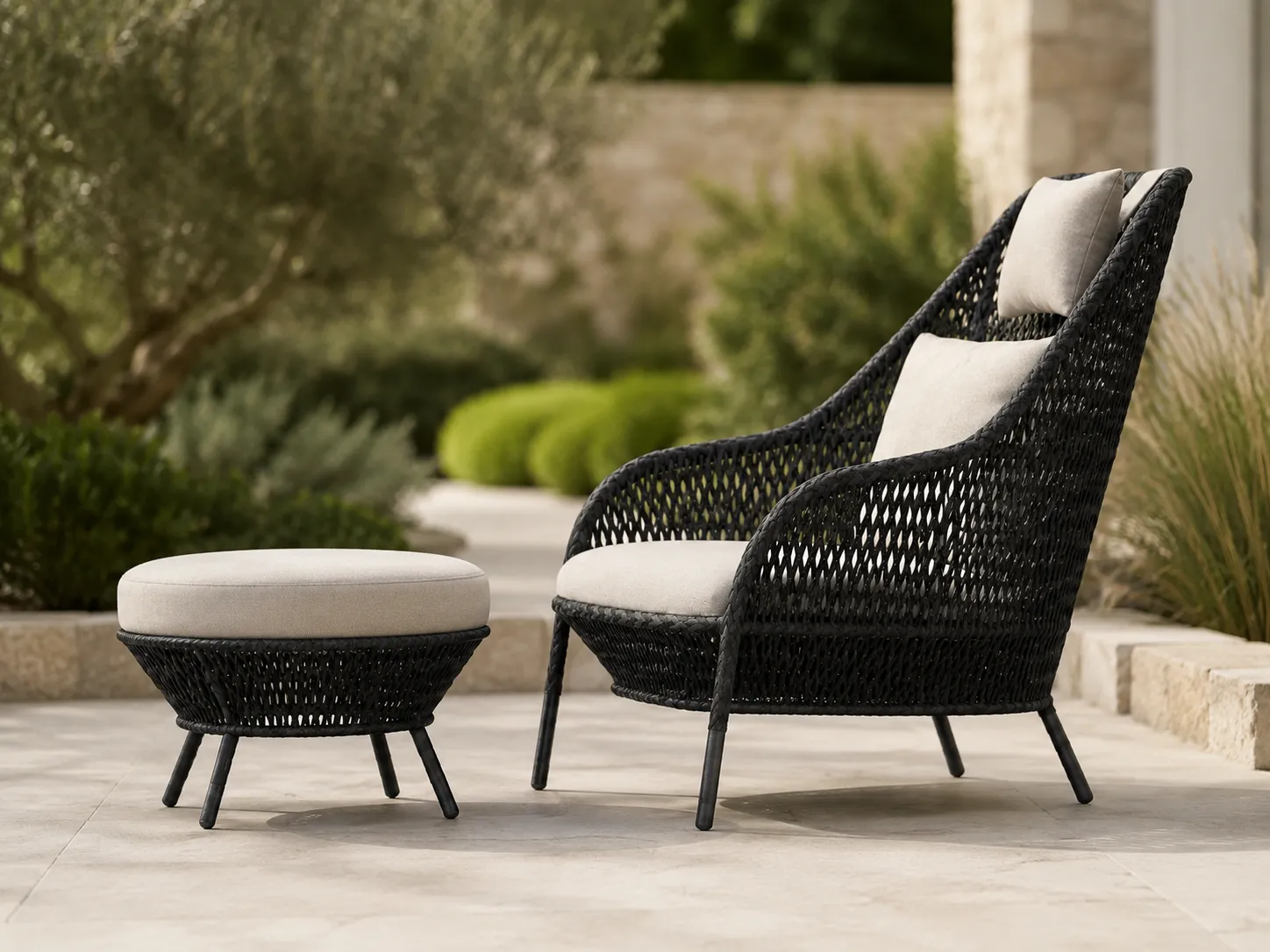 Side view of black wicker outdoor lounge chair with matching ottoman