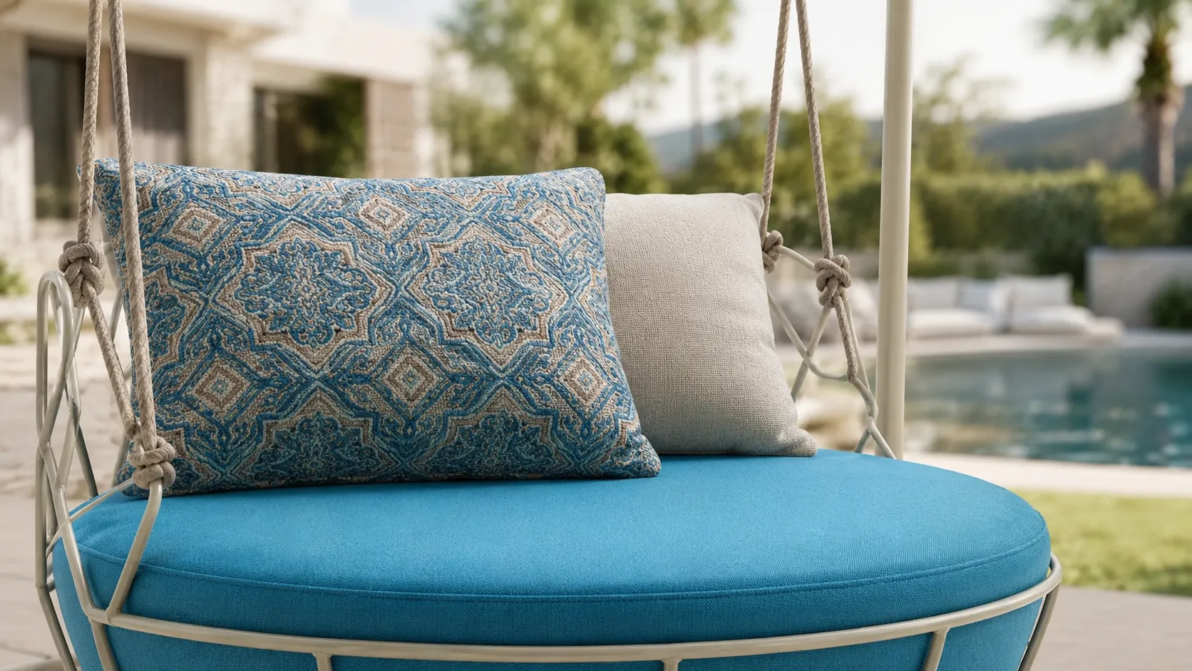 Blue cushion detail of stainless steel outdoor hanging swing chair