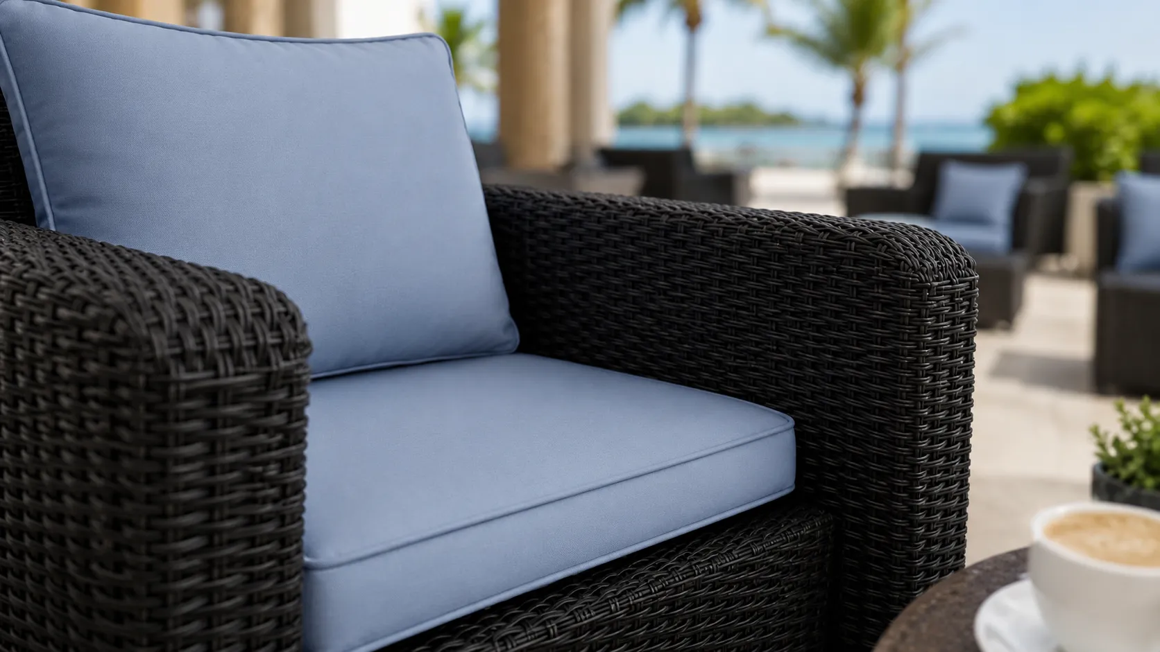 Blue seat cushion detail of PE rattan outdoor armchair