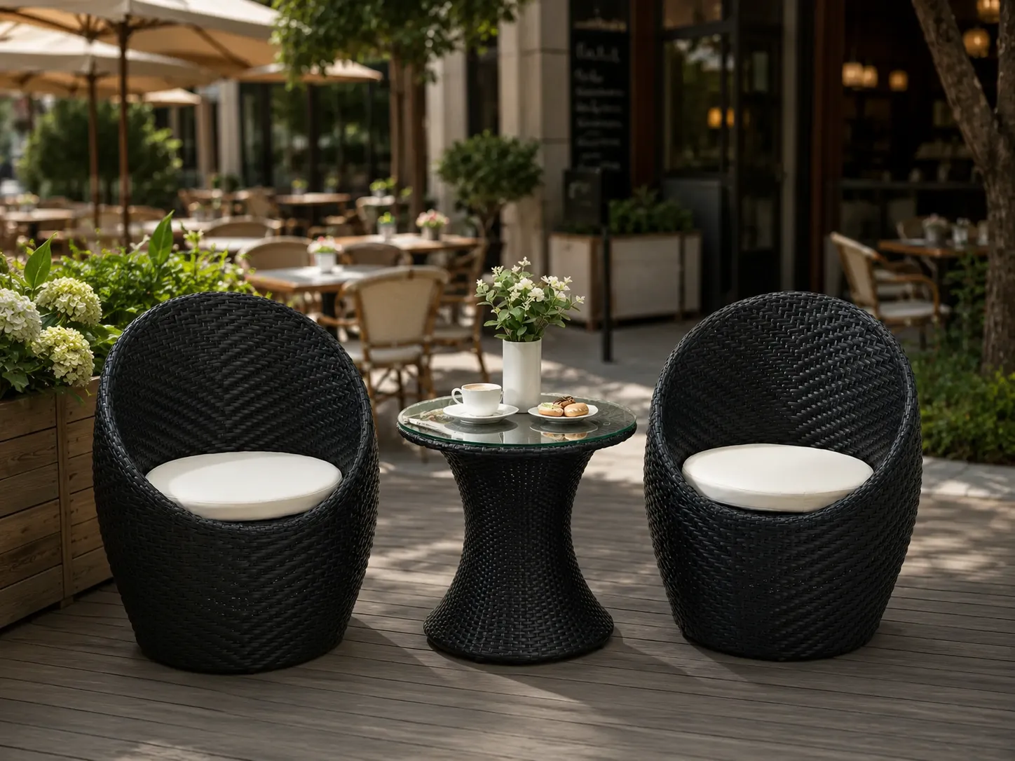 Black rattan bistro set with round glass table for café terrace