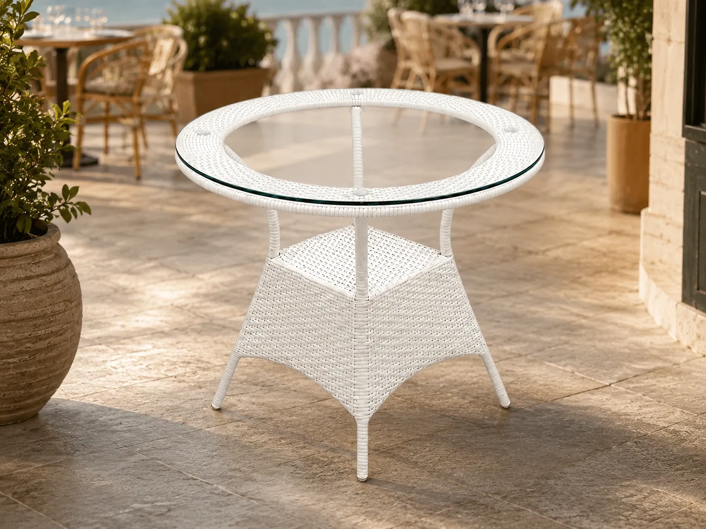 White wicker glass table for cafe terrace and outdoor dining projects