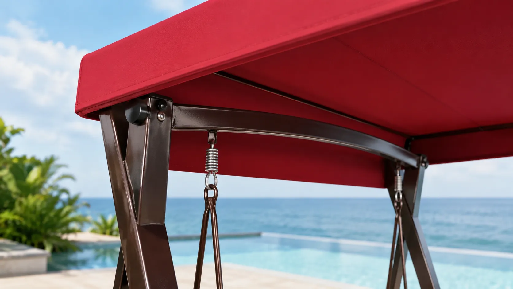 Canopy and hanging hardware detail of wicker outdoor swing chair