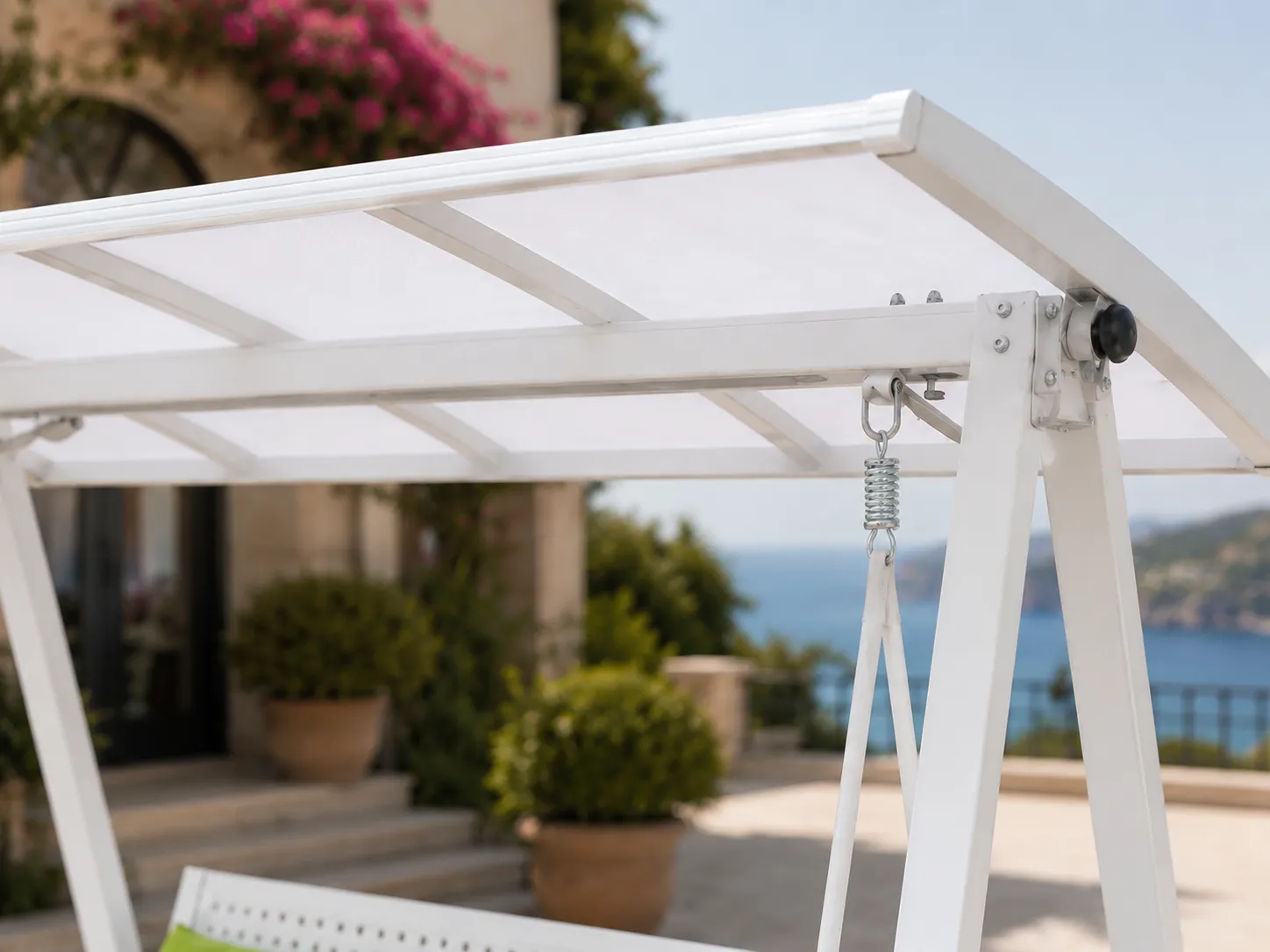 Canopy roof detail of white outdoor swing sofa