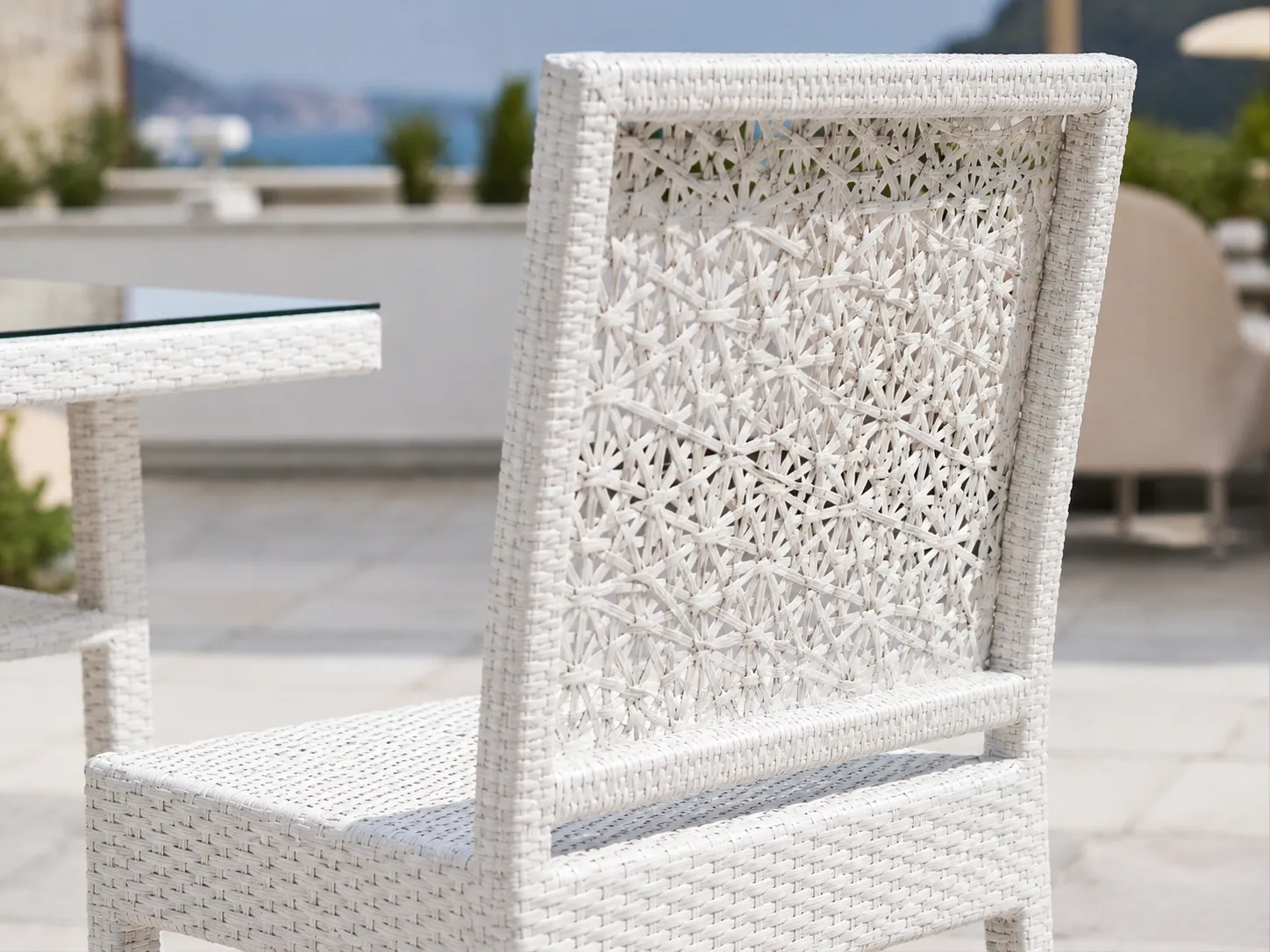Decorative open-weave rattan chair back detail