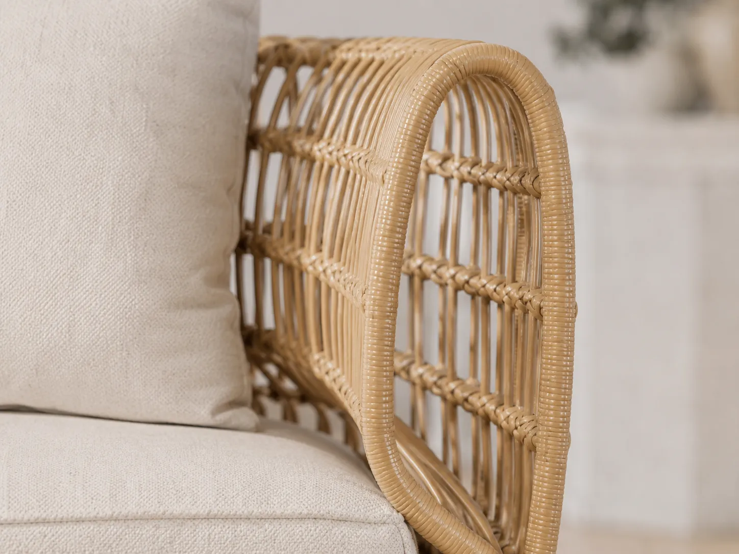 Handwoven rattan frame detail of natural outdoor lounge chair