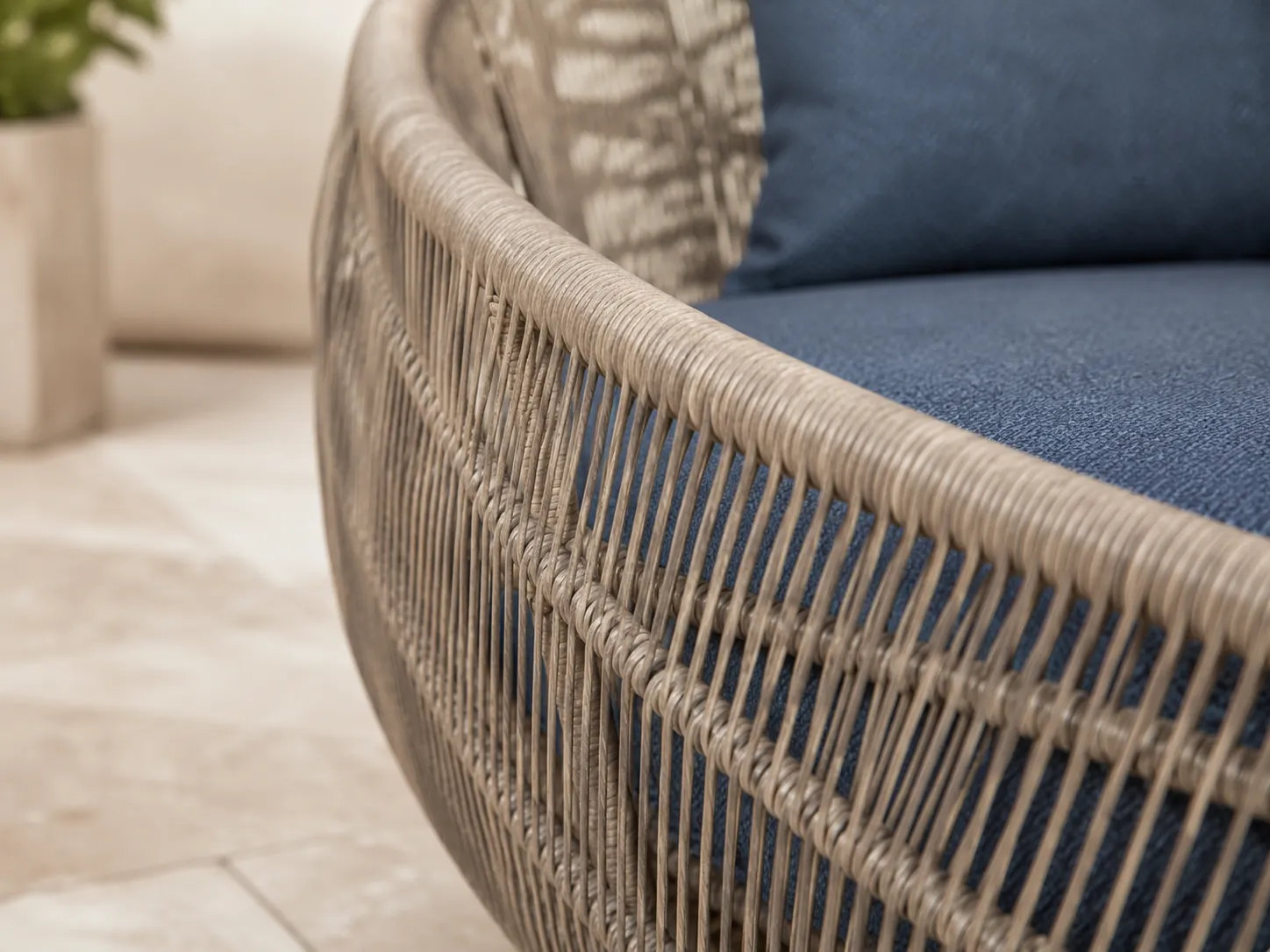 Handwoven wicker detail of round outdoor daybed frame