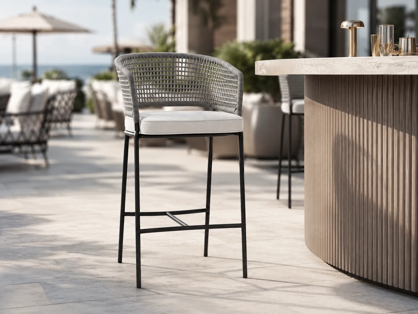 Grey rope bar stool used in a hotel bar seating area