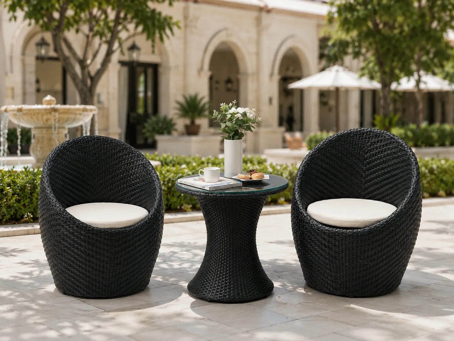 Black wicker bistro set for hotel courtyard