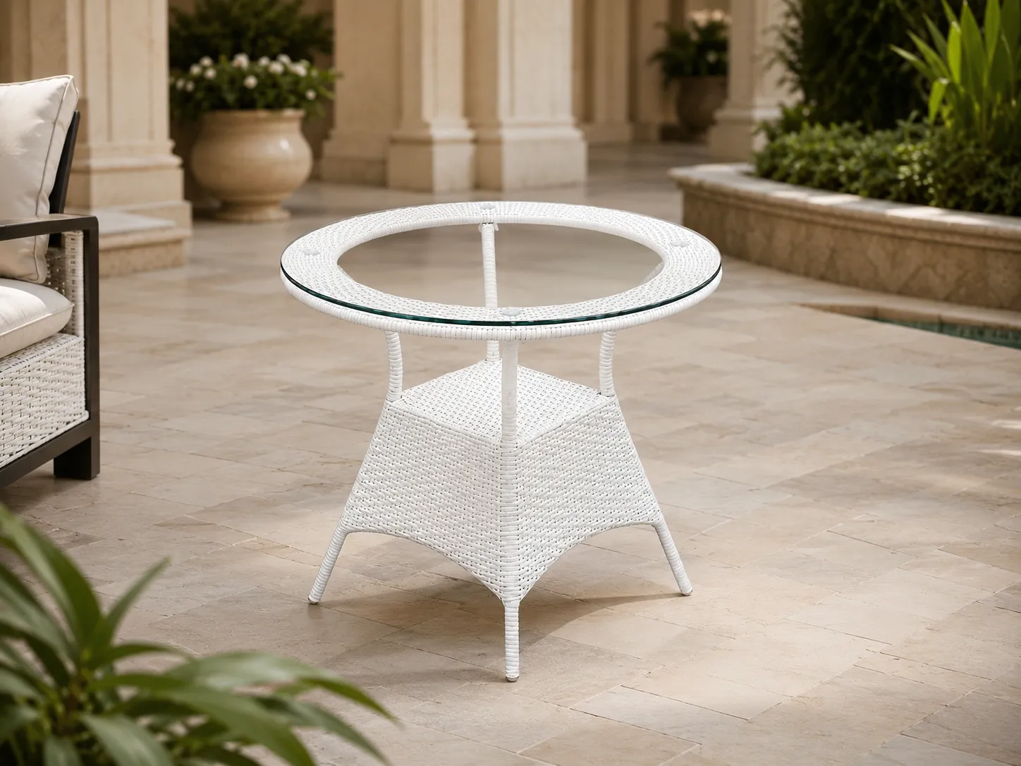 White wicker round table for hotel courtyard outdoor hospitality spaces