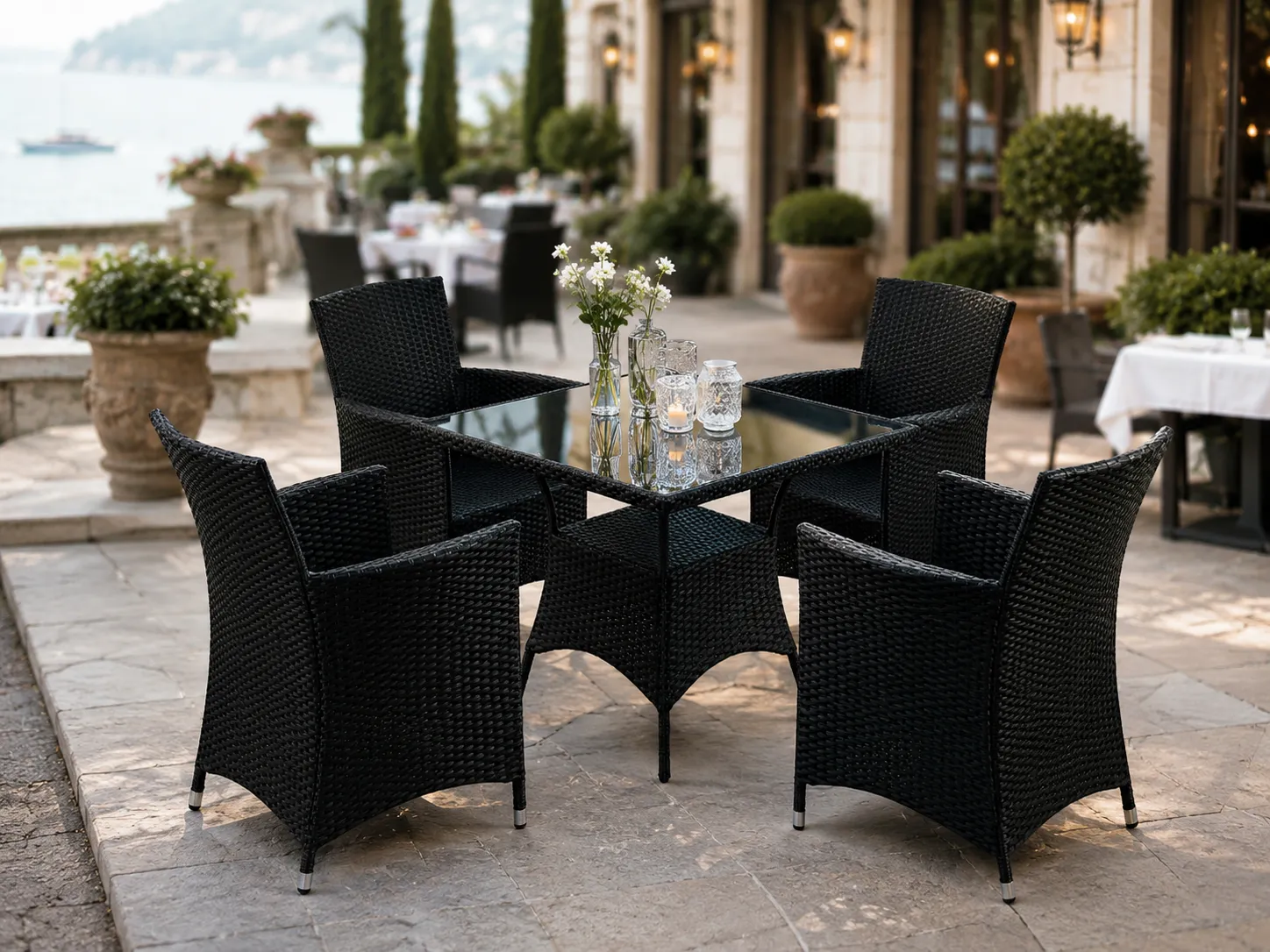 Black rattan dining set for hotel terrace outdoor dining area