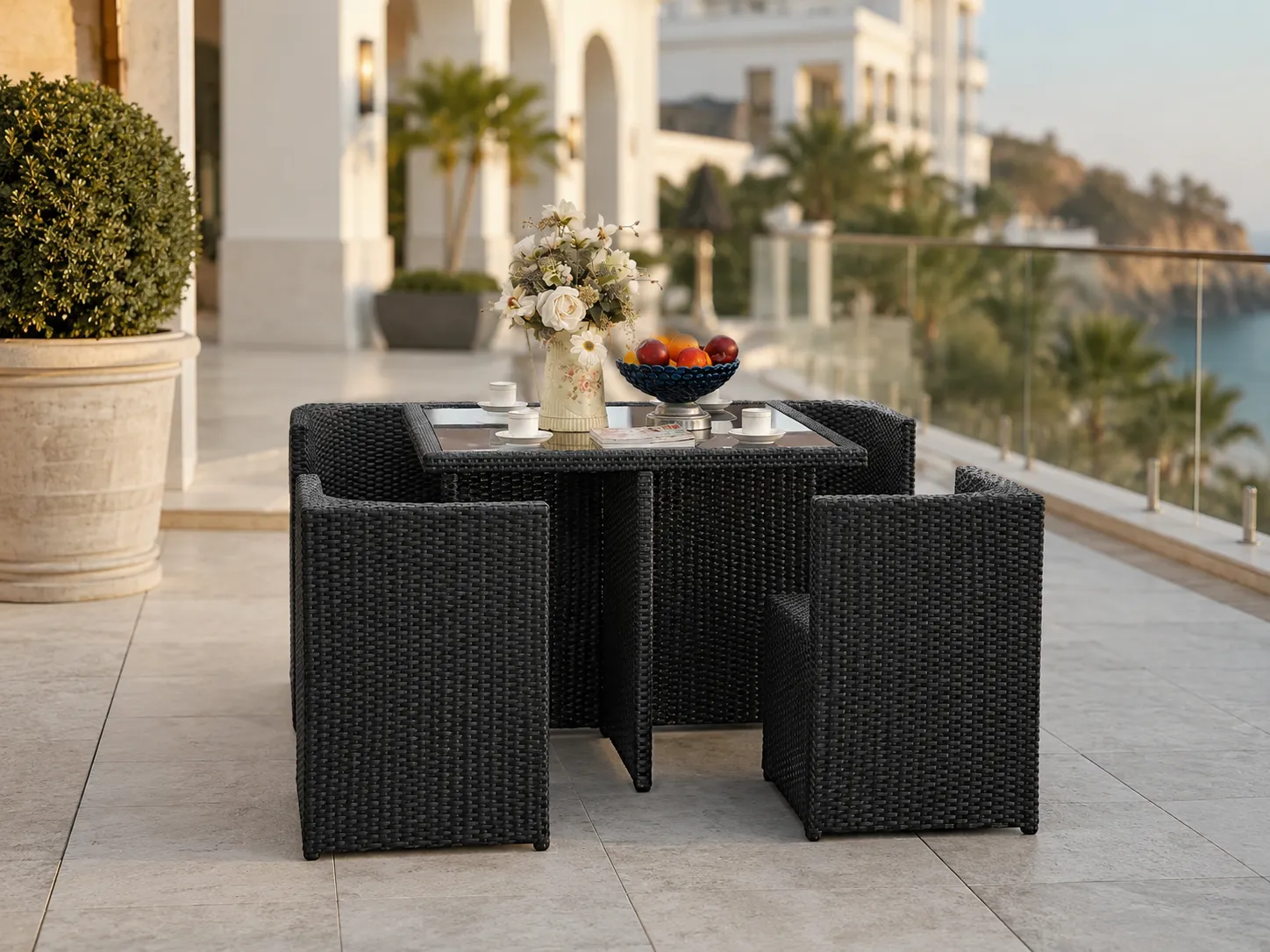 Black wicker dining set for hotel terrace