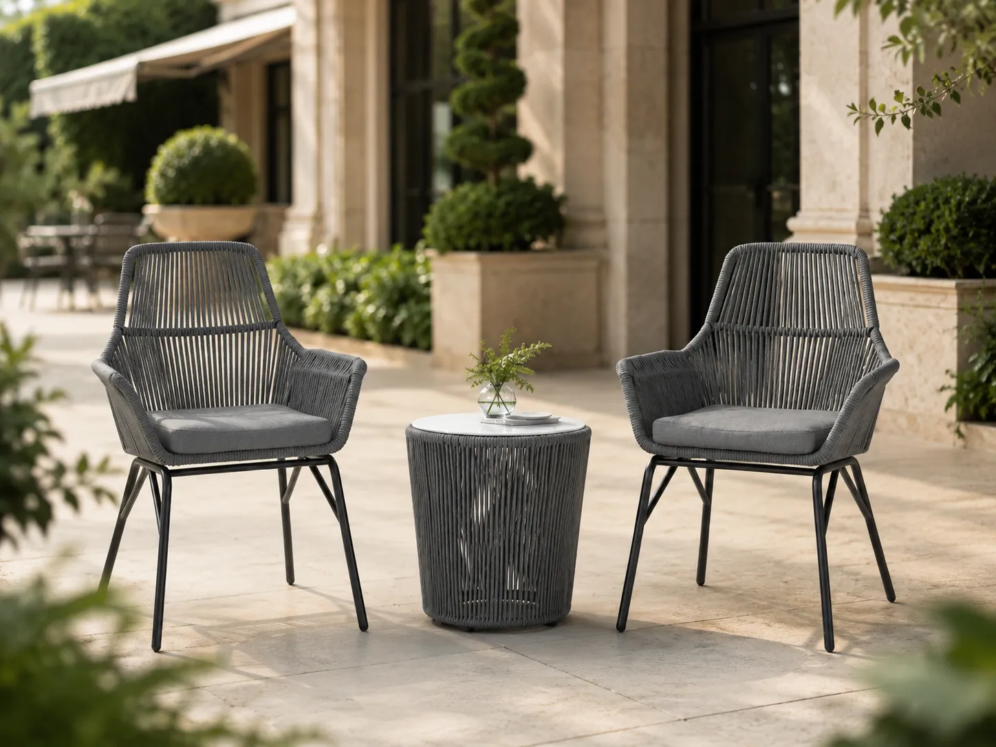 Outdoor rope bistro set with grey chairs for hotel terrace