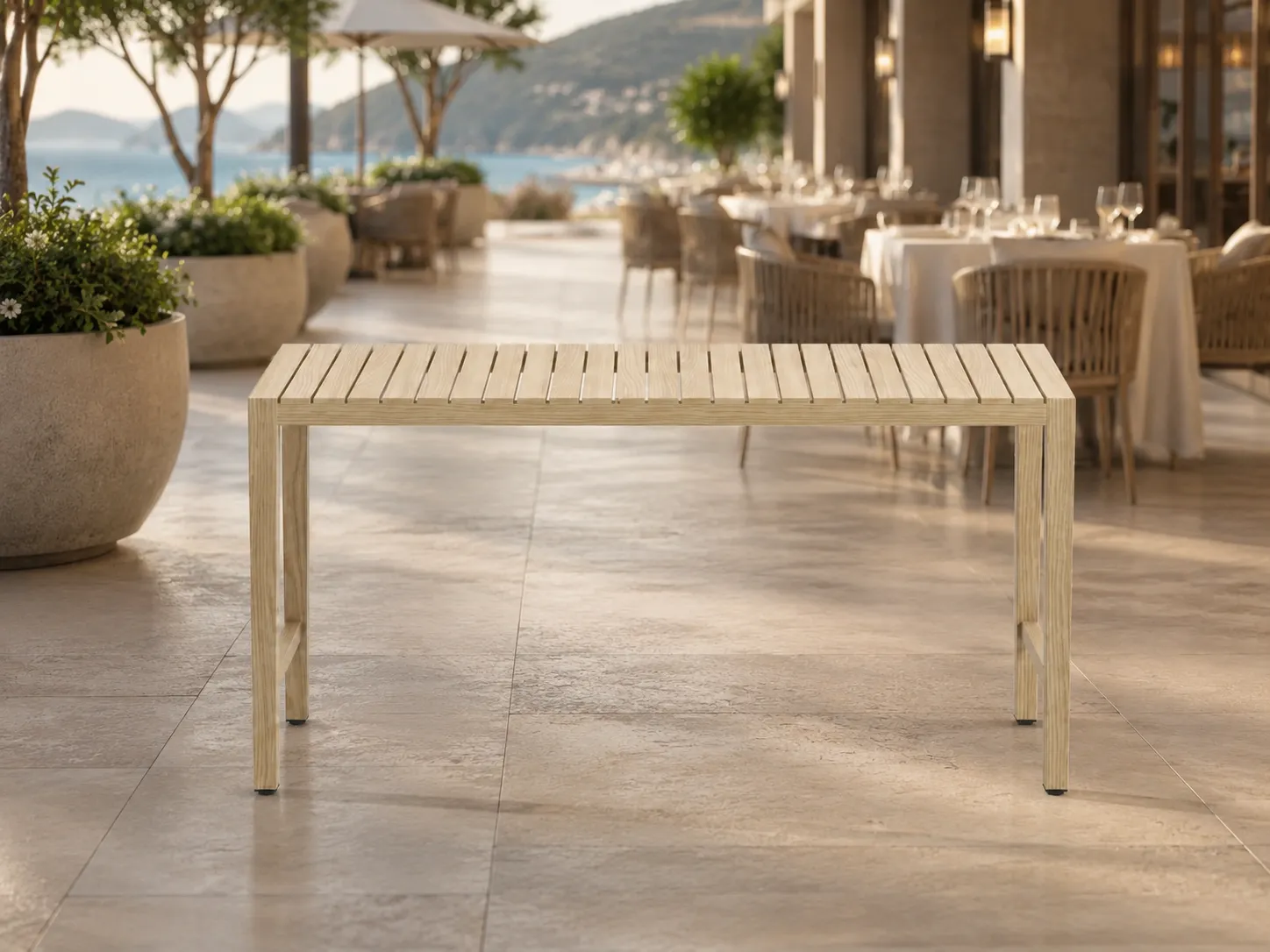 Teak outdoor dining table used on a hotel terrace dining area