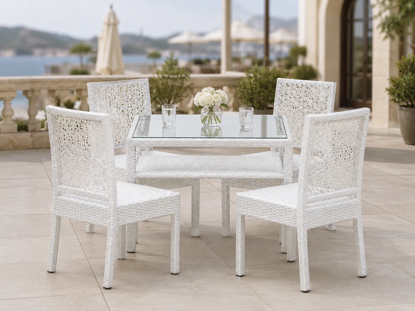 White wicker dining set for hotel terrace