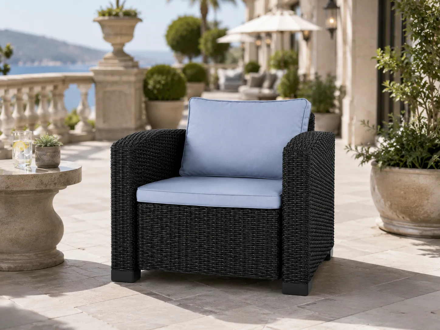 Wicker outdoor armchair for hotel terrace seating
