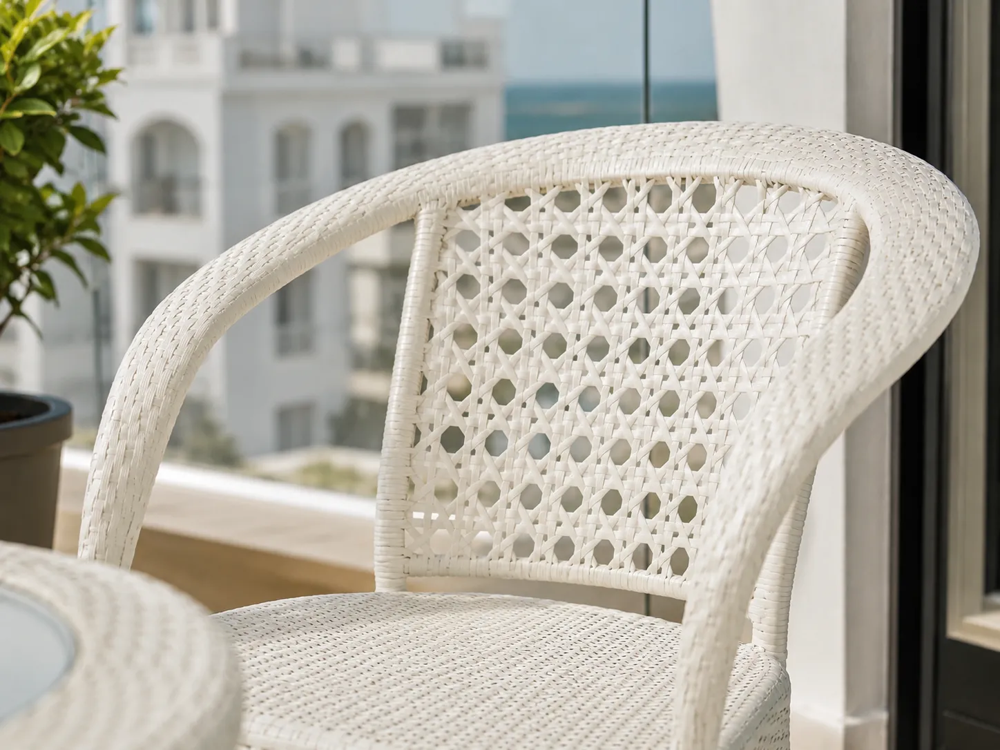 Open-weave white rattan chair back detail