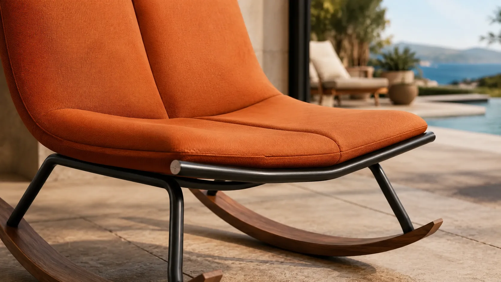 Orange padded cushion detail of teak outdoor rocking lounge chair