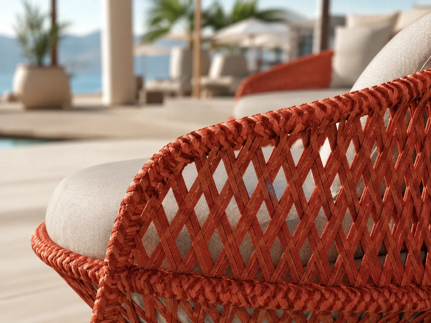 Close-up detail of orange woven wicker frame for outdoor sofa set