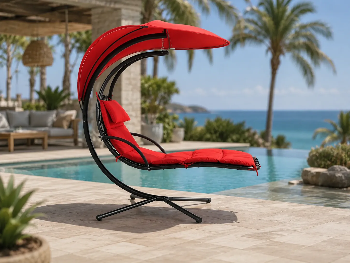 Stainless steel outdoor hanging lounge chair beside a resort swimming pool
