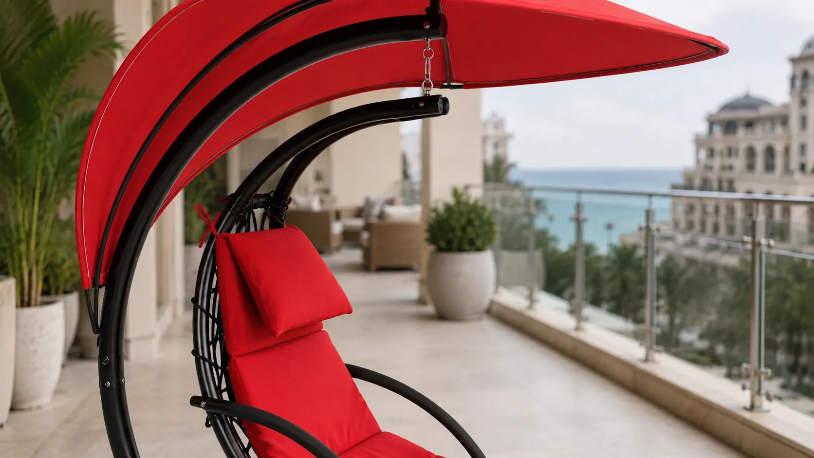 Red canopy detail of stainless steel outdoor hanging lounge chair