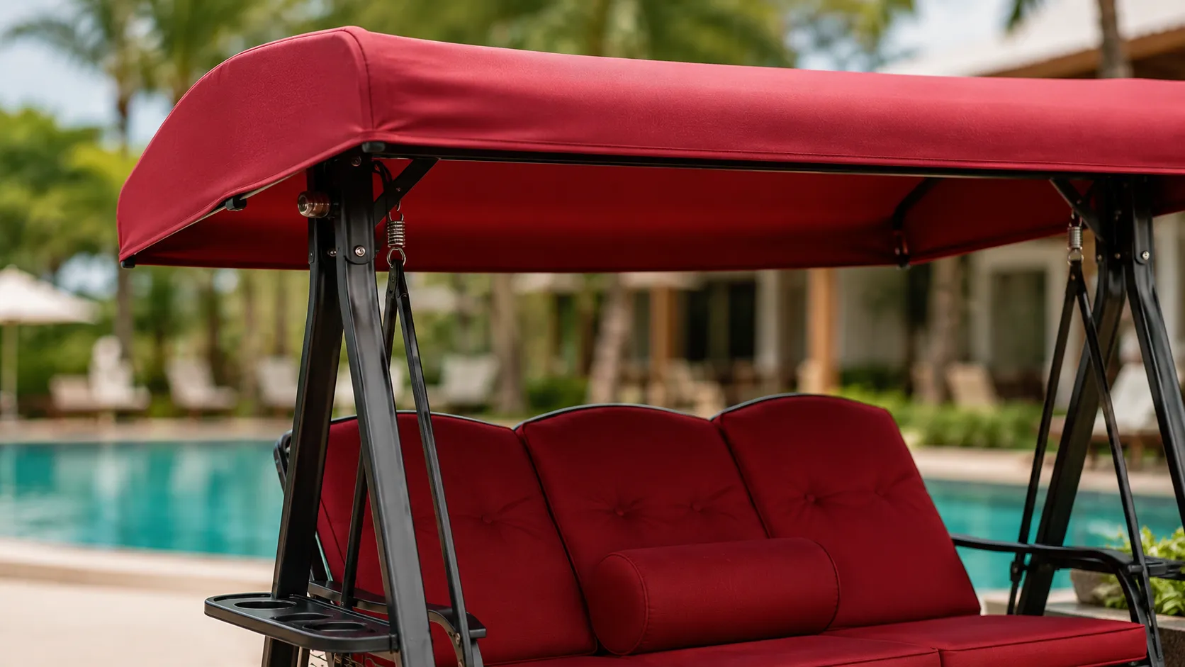 Red canopy detail of steel outdoor swing sofa