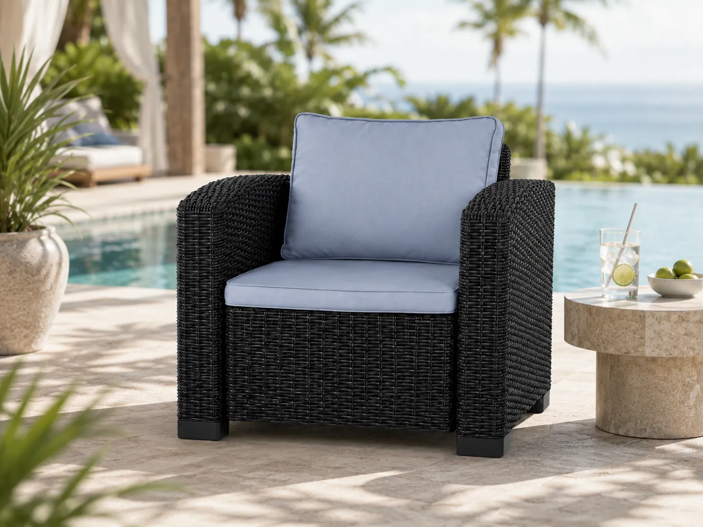Black rattan outdoor armchair for resort lounge spaces