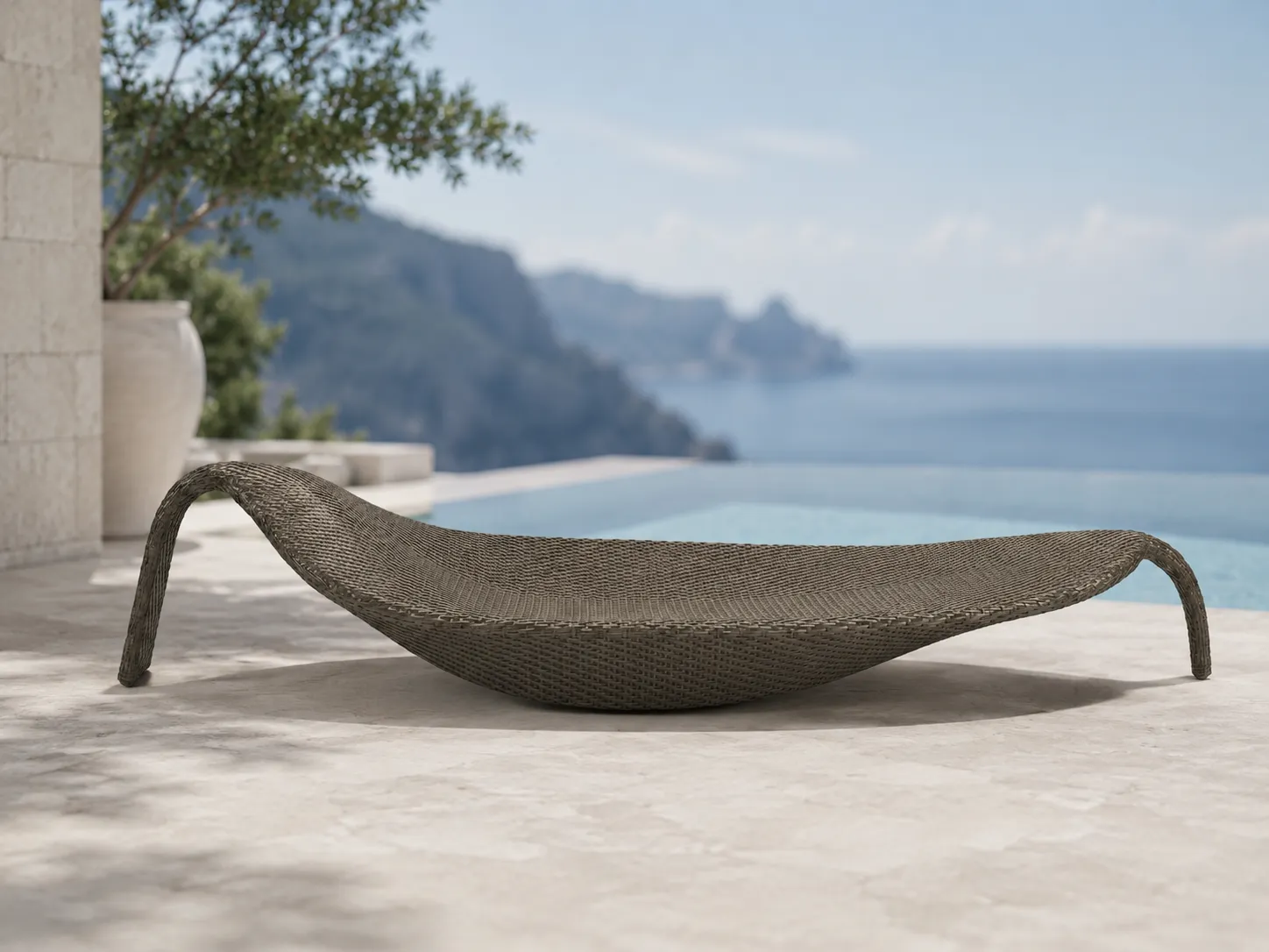 Curved wicker sun lounger for resort terrace lounge spaces