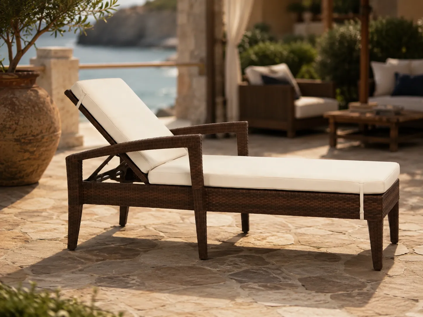 Wicker sun lounger with armrests for resort terrace lounge spaces