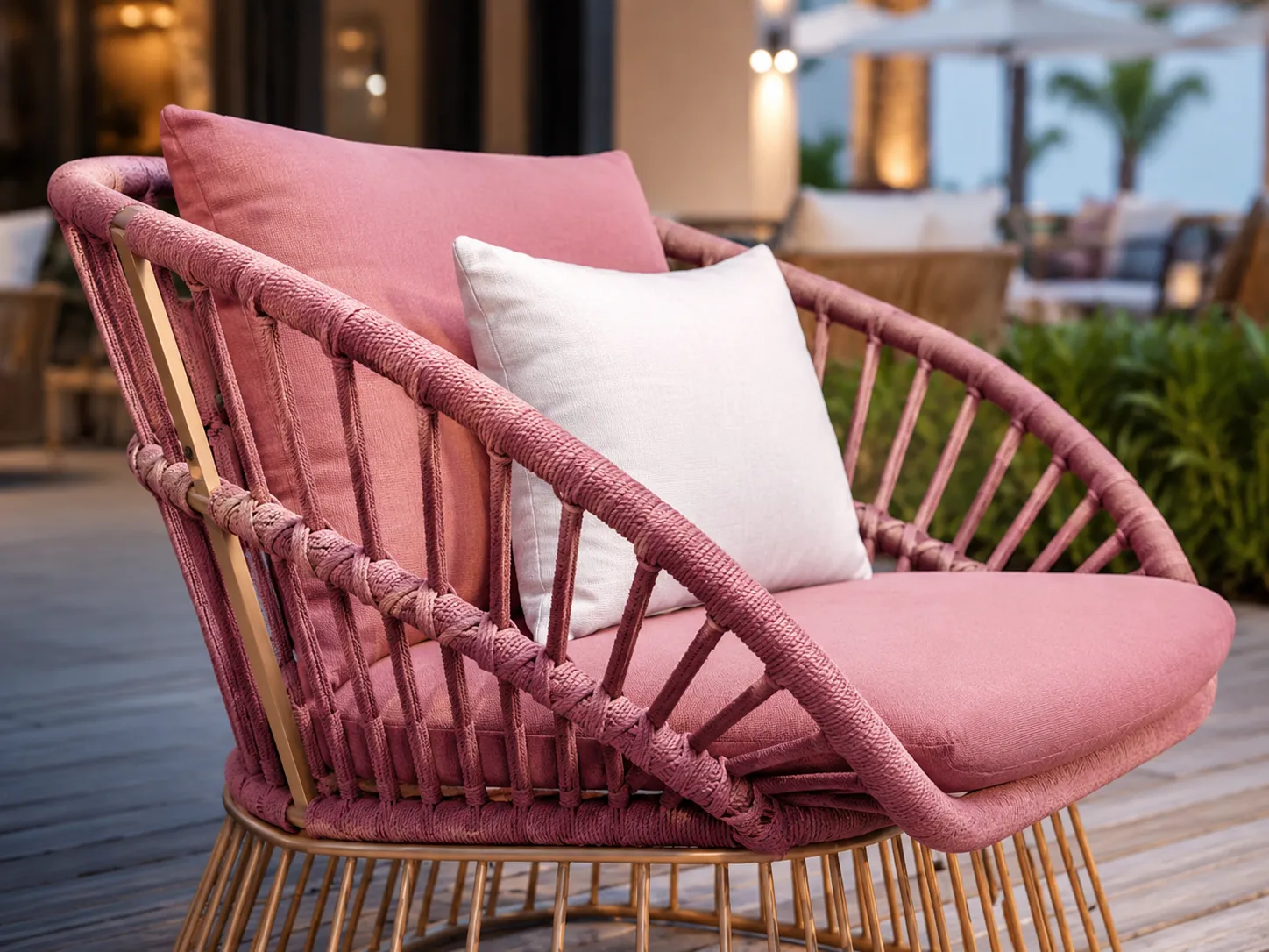Rope weave frame detail of pink outdoor sofa and lounge chair set