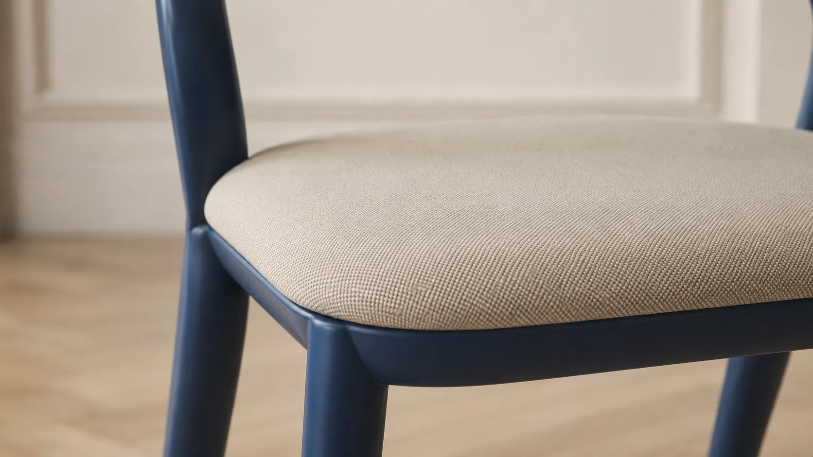 Upholstered seat cushion detail of modern black dining chair