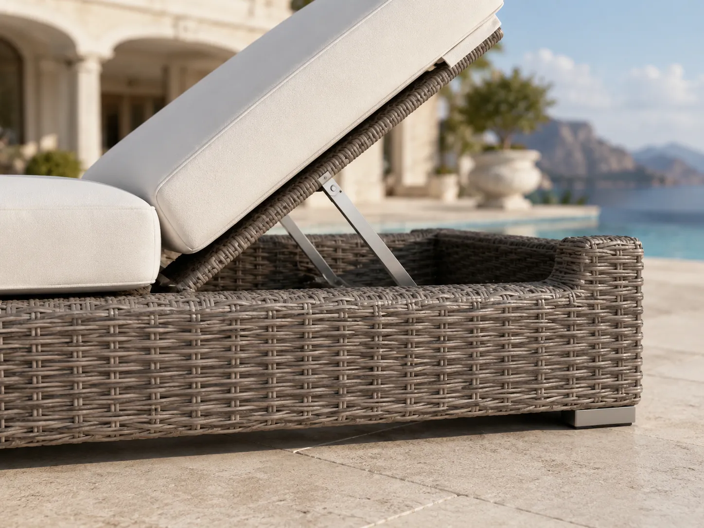 Close-up detail of woven wicker base on outdoor sun lounger