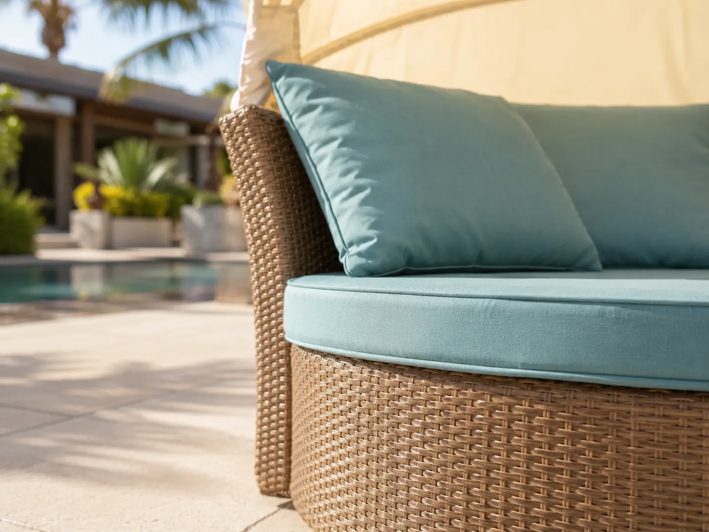 Close-up detail of woven wicker frame on adjustable canopy daybed